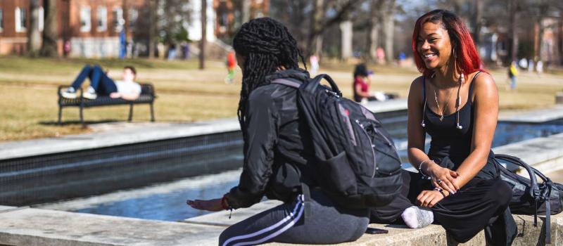 Students outdoors on the Mall on an unseasonably warm February day.